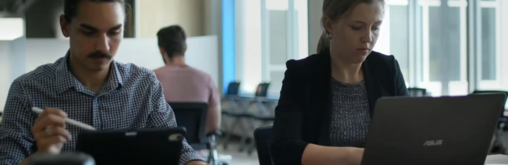 people working in a shared office space